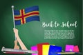 Vector flag of Aland on Black chalkboard background. Education Background with Hands Holding Up of Aland flag. Back to school with