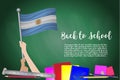 Vector flag of Argentina on Black chalkboard background. Education Background with Hands Holding Up of Argentina flag. Back to sch