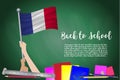 Vector flag of France on Black chalkboard background. Education Background with Hands Holding Up of France flag. Back to school wi