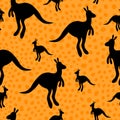 Vector flat illustration with silhouette kangaroo and baby kangaroo on fiery background. Seamless pattern on orange