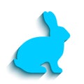 Vector flat light blue side silhouette of a rabbit with long shadow isolated on white background.