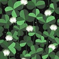 Vector floral seamless pattern with clover leaves and flowers. Saint Patricks day background with shamrock. Design with clover