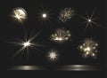 Vector glowing light effects set, explosions and stars, glittering design elements isolated on dark background Royalty Free Stock Photo