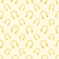 Vector gold seamless pattern of lucky horse shoes