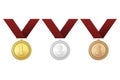 Vector gold, silver and bronze award medals with red ribbons set on white background. The first, second, third Royalty Free Stock Photo