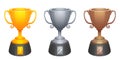 Vector gold, silver, bronze cups trophy awards with base. Prizes for the first, second and third place. Royalty Free Stock Photo