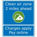 Vector graphic road sign for a clean air zone two miles ahead. Charges will be raised which need to be paid online