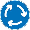 Vector graphic of a uk mini roundabout road sign. It consists of three circular arrows in a clockwise direction contained within a