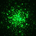 Vector green glowing light glitter background. Magic glow light effect. Star burst with sparkles on dark background