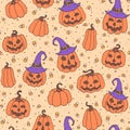 Vector Halloween seamless pattern with candy corns, smiling pumpkins and witch hats on the yellow dotted background