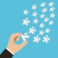 Vector of hand of businessman holding pieces of jigsaw. Hand wit Royalty Free Stock Photo