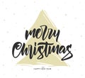 Vector hand drawn calligraphic brush type lettering composition of Merry Christmas with golden Christmas tree. Royalty Free Stock Photo