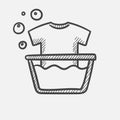 T-shirt in basin with foam hand drawn sketch icon. Royalty Free Stock Photo