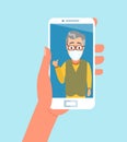 Vector of hand holding smart phone chatting with elderly family member wearing face mask via video call app