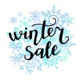 Vector hand lettering illustration Winter sale with doodle snowflakes