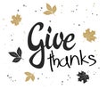 Vector hand lettering thanksgiving greetings text - give thanks with leaves in gold color