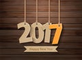 Vector 2017 happy new year paper hanging on wood Royalty Free Stock Photo