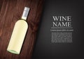 Advertising banner.A realistic bottle of white wine with black label in photorealistic style on wooden dark board,black