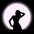 Vector illustration of a black silhouette of a beautiful girl with long hair and eyelashes arched at the waist, right hand to the Royalty Free Stock Photo