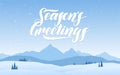 Blue mountains winter snowy landscape with hand lettering of Seasons Greetings. Royalty Free Stock Photo