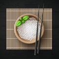 Vector illustration of bowl full of rice grains and basil with chopsticks on bamboo mat Royalty Free Stock Photo