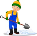 Boy removing the snow with the shovel