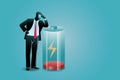 Vector illustration of business concept, tired businessman lean at low battery