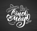 Calligraphic type lettering of Cinco De Mayo with hand drawn sombrero, maracas and pepper on chalkboard background Royalty Free Stock Photo