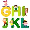 Cartoon kids with GHIJKL letters Royalty Free Stock Photo