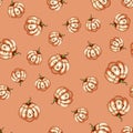 Vector illustration of a colored autumn seamless pattern of pumpkin vegetables for halloween with a face Royalty Free Stock Photo