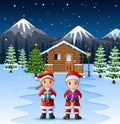 Couple santa claus holding a box gift in front of the snowy wooden house