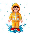 Cute boy cartoon using raincoat standing under rain with smile