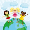 Happy multi ethnic girls standing on the earth. Royalty Free Stock Photo