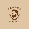 A vector illustration depicting a man`s face with a beard and glasses over two crossed razors. Logo of the men`s hairdresser.