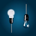 Vector illustration of energy-saving and incandescent bulbs in black cartridges with wires located next to each other on a blue