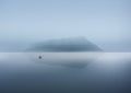 Vector illustration. Fisherman in a boat on the lake the morning lake in fog. Royalty Free Stock Photo