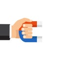 Human hand holding a magnet. Vector illustration, flat style, is Royalty Free Stock Photo