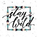 Vector illustration with hand-drawn lettering `Stay wild` and tribal frame Royalty Free Stock Photo