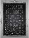 Hand drawn rustic font, chalcboard alphabet and set of hand drawn frames, dividers, borders decorative elements on wood background Royalty Free Stock Photo