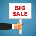 Vector illustration of hand holding rectangular banner with big sale text