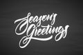 Vector illustration. Handwritten calligraphic brush txtured lettering of Seasons Greetings on chalkboard background Royalty Free Stock Photo