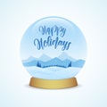 Happy Holidays. Snow globe with winter mountains landscape isolated on light blue background. Royalty Free Stock Photo