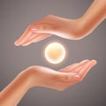 Hands holding sphere