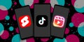 Vector illustration of Instagram Reels, TikTok and Yotube Shorts icons depicted on smartphone screens. Short video sharing