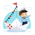 Little boy in sailor costume standing in a paper boat Royalty Free Stock Photo