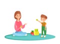 Vector illustration of mom playing blocks with her son on the carpet. Playing at home, time with family, nanny with kid