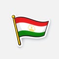 Sticker flag of Tajikistan on flagstaff