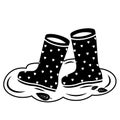 Vector illustration of the rubber boots icon in a puddle. Creative sign Symbol, logo, vector graphics. Royalty Free Stock Photo