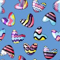 Vector illustration. Seamless pattern with cute hearts painted in rainbow colors on the blue background Royalty Free Stock Photo