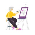 Senior lady artist painting at the easel